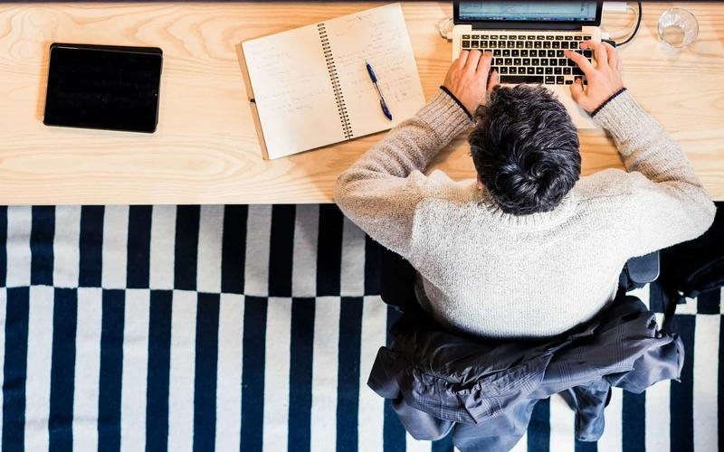 Business owner working through paperwork at a desk